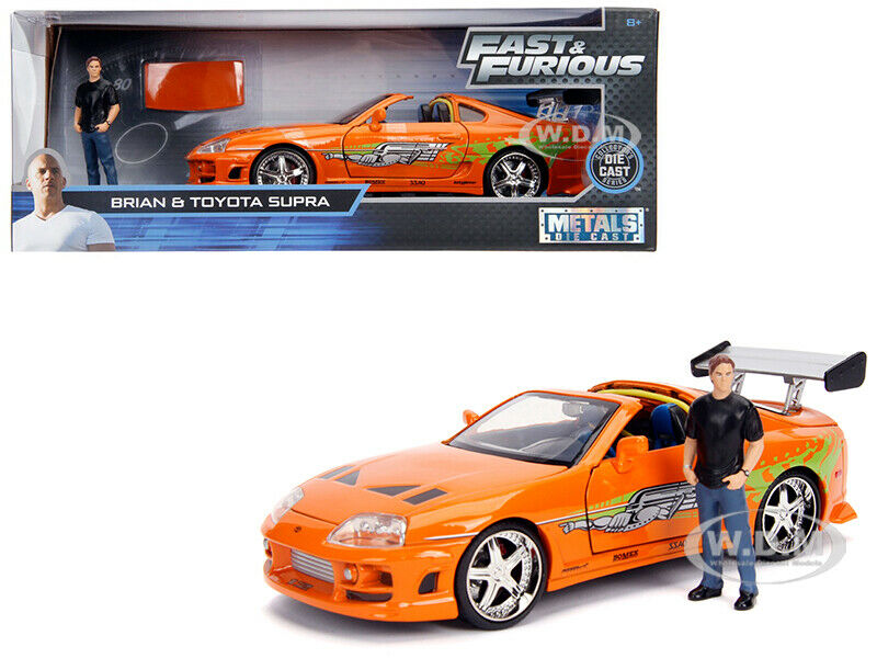Toyota Supra Orange Metallic with Brian Diecast Figurine "Fast &amp; Furious" Movie 1/24 Diecast Model Car by Jada