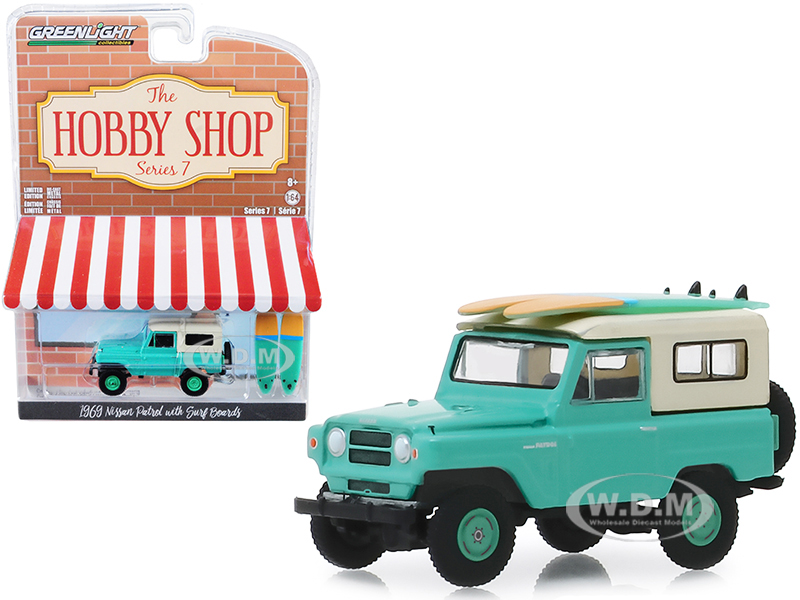 1969 Nissan Patrol Green With Two Surf Boards "the Hobby Shop" Series 7 1/64 Diecast Model Car By Greenlight