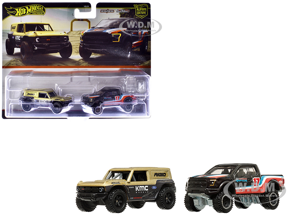 Ford Bronco R Gold Metallic and Black and 2017 Ford F-150 Raptor Pickup Truck #17 Black with Stripes Car Culture Set of 2 Cars Diecast Model Cars by Hot Wheels